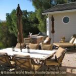 Outdoor dining area near bbq and door to kitchen