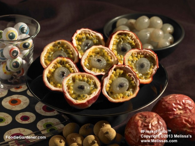 Zombie eyeballs made with stuffed passion vine fruit shells, grapes and pomegranate seeds